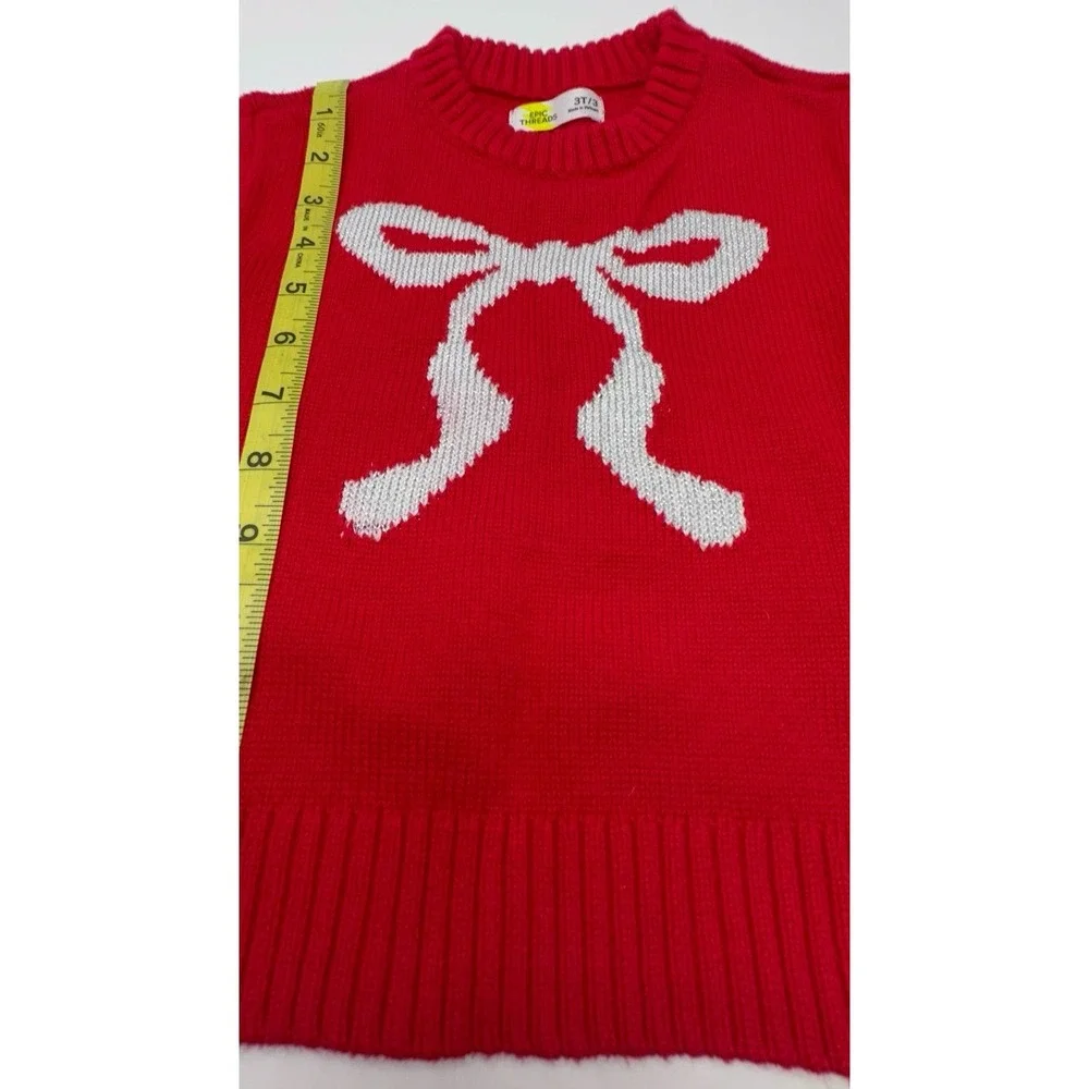 Gently worn toddler girl size 3T Epic Threads red sweater with silvery white bow